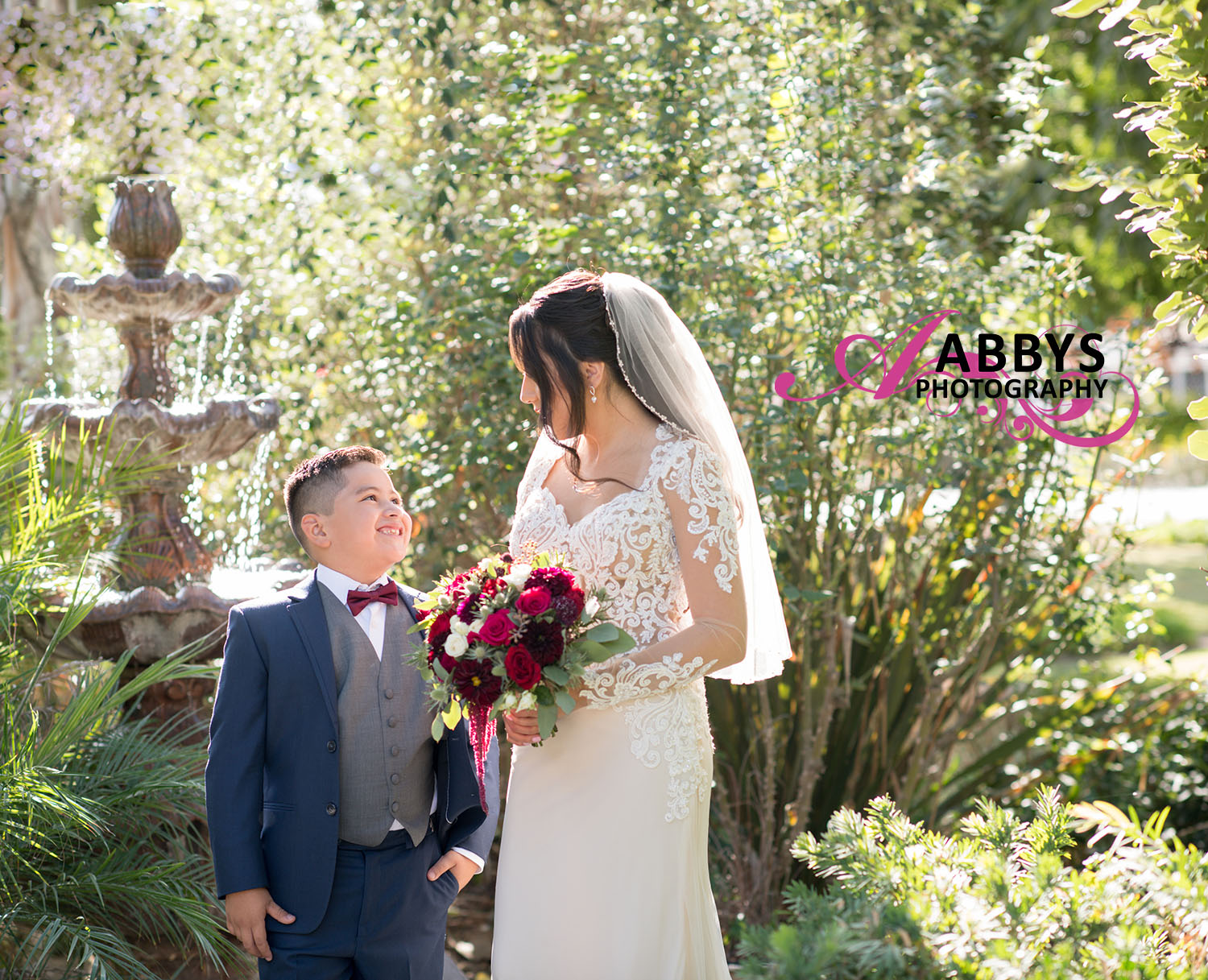 This boy is happy on his mother’s wedding day, and Abbys Photography captured the moment. 
