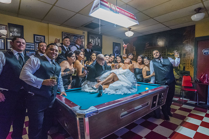 Gather around this Bakersfield bar’s pool table for some creative wedding photography! 